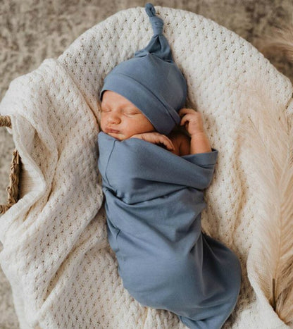 Cotton newborn sleeping bag and matching hat, essential baby accessory for peaceful nights