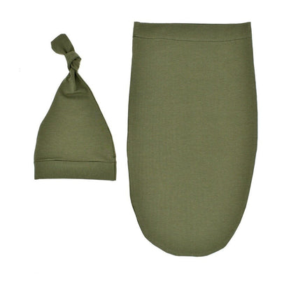 Blue newborn swaddle sleeping bag and infant hat, designed for safe and snug baby sleep