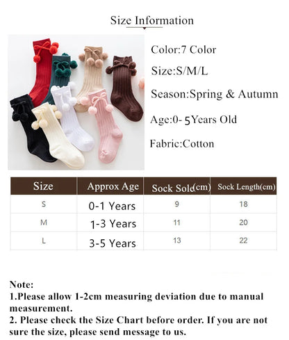 Organic cotton soft knit knee-high baby socks, gentle on delicate skin.