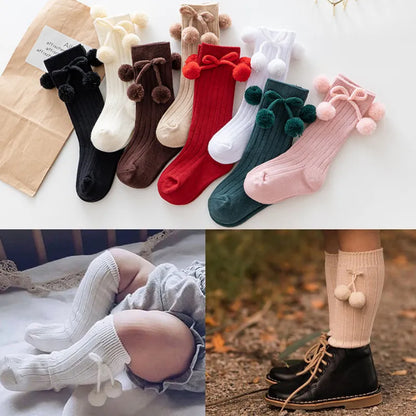 Unisex cotton knee-high socks for baby boys and girls, comfortable & stylish.