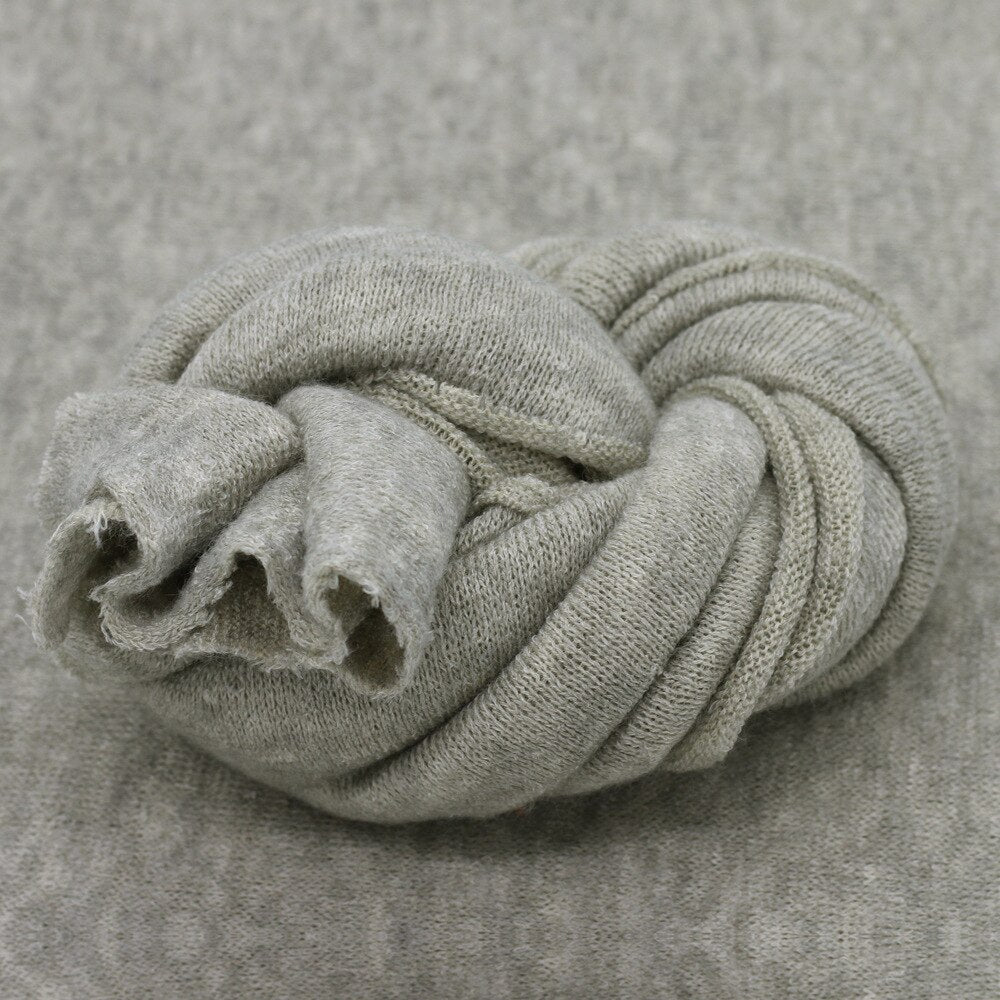 Cozy knitted baby blanket, perfect newborn photography prop, also functions as a soft studio backdrop.