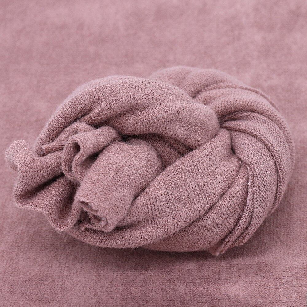 Infant comfort knitted blanket wrap for baby photography shoots, also useful as a studio backdrop.