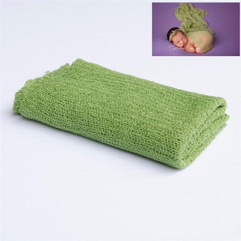 Charming knitted baby blanket, an ideal accessory for an adorable baby photoshoot