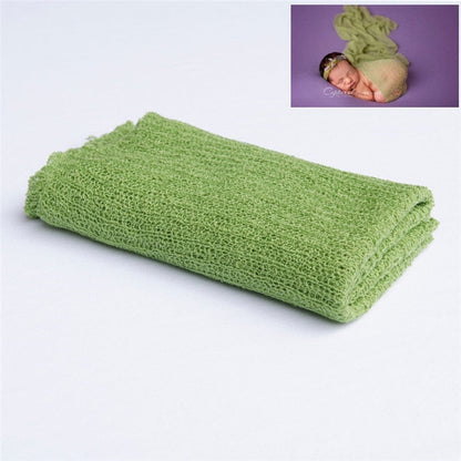 Charming knitted baby blanket, an ideal accessory for an adorable baby photoshoot