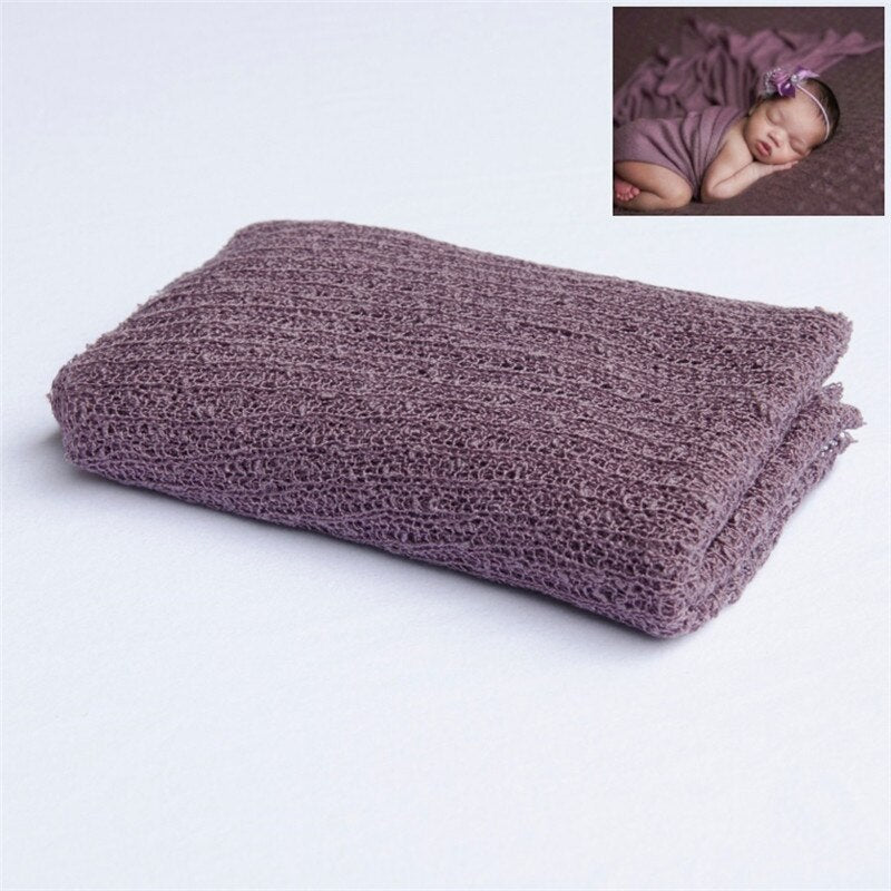 Baby accessories: soft knitted cream wrap, a must-have for infant photoshoots