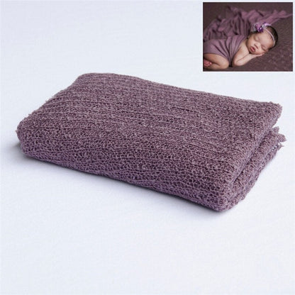 Baby accessories: soft knitted cream wrap, a must-have for infant photoshoots