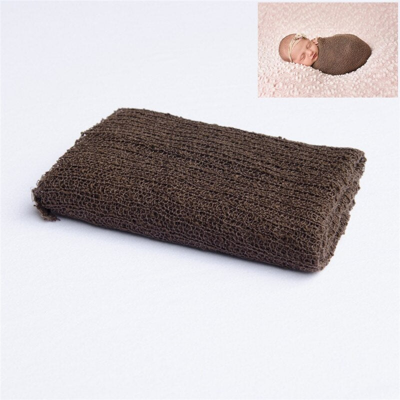 Newborn photography prop: delicate knitted baby wrap blanket in a neutral shade