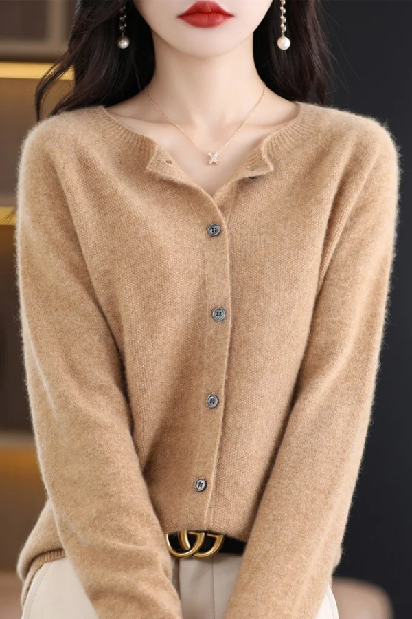 Close-up of the plush soft knit texture of a women's long cardigan, highlighting quality.