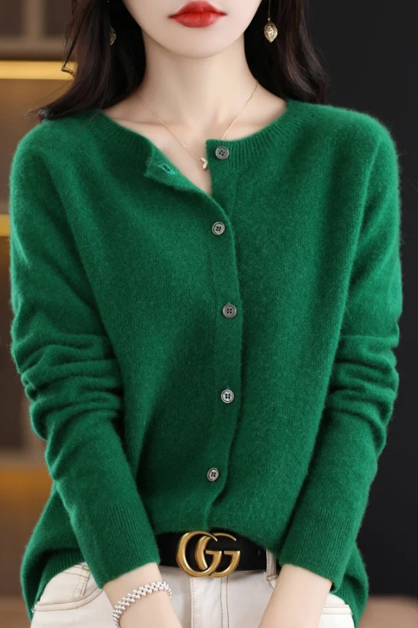 Detail shot of the elegant buttons on a soft long women's cardigan, enhancing its chic look.