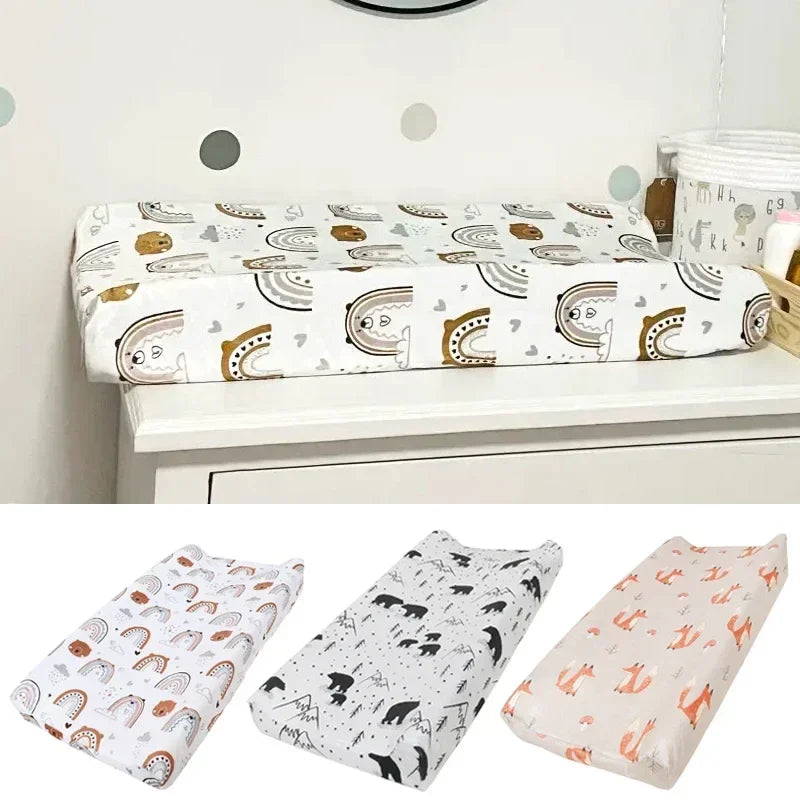 Soft minky baby changing pad cover with adorable pink and white elephant print for nursery.