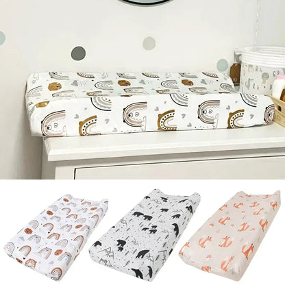 Soft minky baby changing pad cover with adorable pink and white elephant print for nursery.