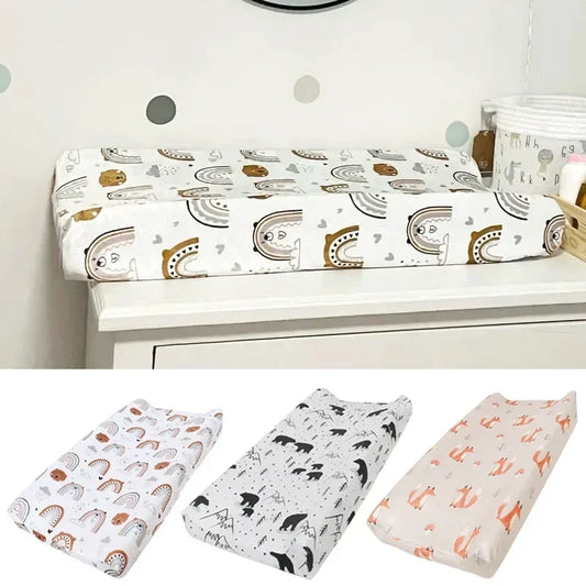 Soft minky baby changing pad cover with adorable pink and white elephant print for nursery.