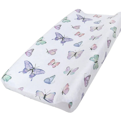 Cozy pink floral print minky baby changing pad cover, a soft and practical nursery item.