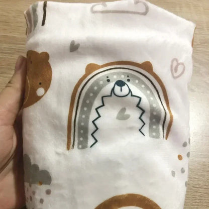 Baby changing pad cover in soft minky fabric with colorful polka dots, reusable and washable.