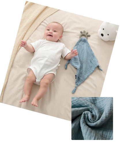 Pack of absorbent muslin baby towels, essential for spills and gentle on a baby's skin.