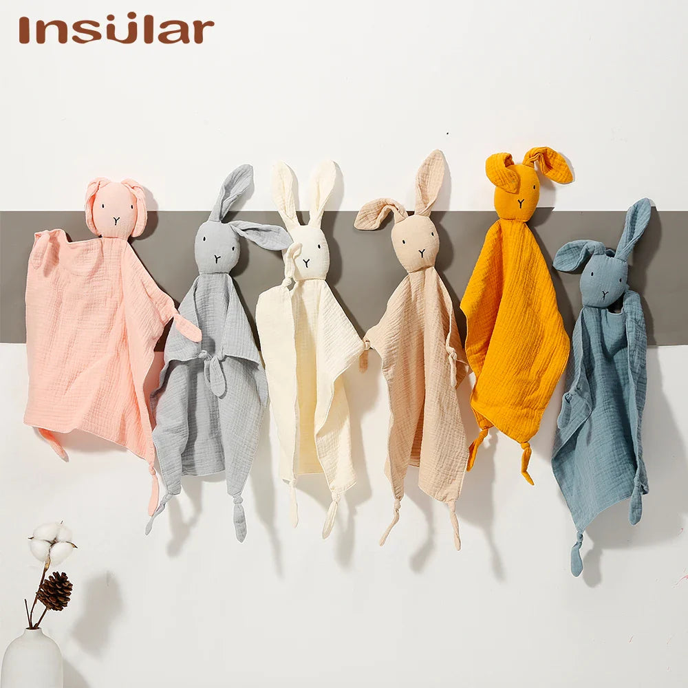 Closeup of a soft muslin baby towel, highlighting its absorbent and breathable fabric.