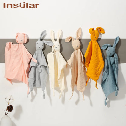 Closeup of a soft muslin baby towel, highlighting its absorbent and breathable fabric.