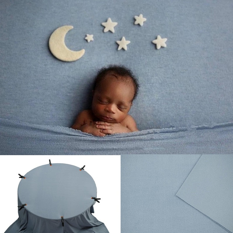 Soft peach newborn wrap and cream textured backdrop, ideal photo accessory
