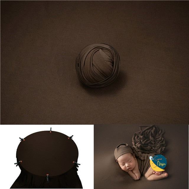 Close-up of knitted cream baby wrap, part of newborn photography backdrop set