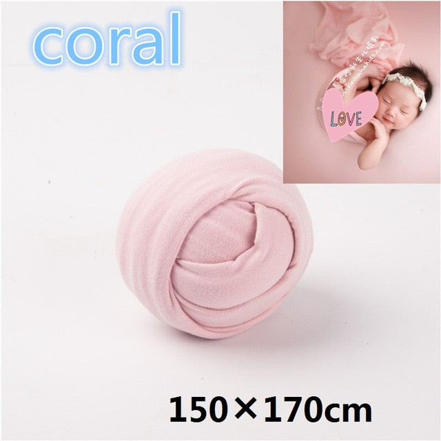 Baby essential: soft, breathable newborn wrap with a plain cotton backdrop