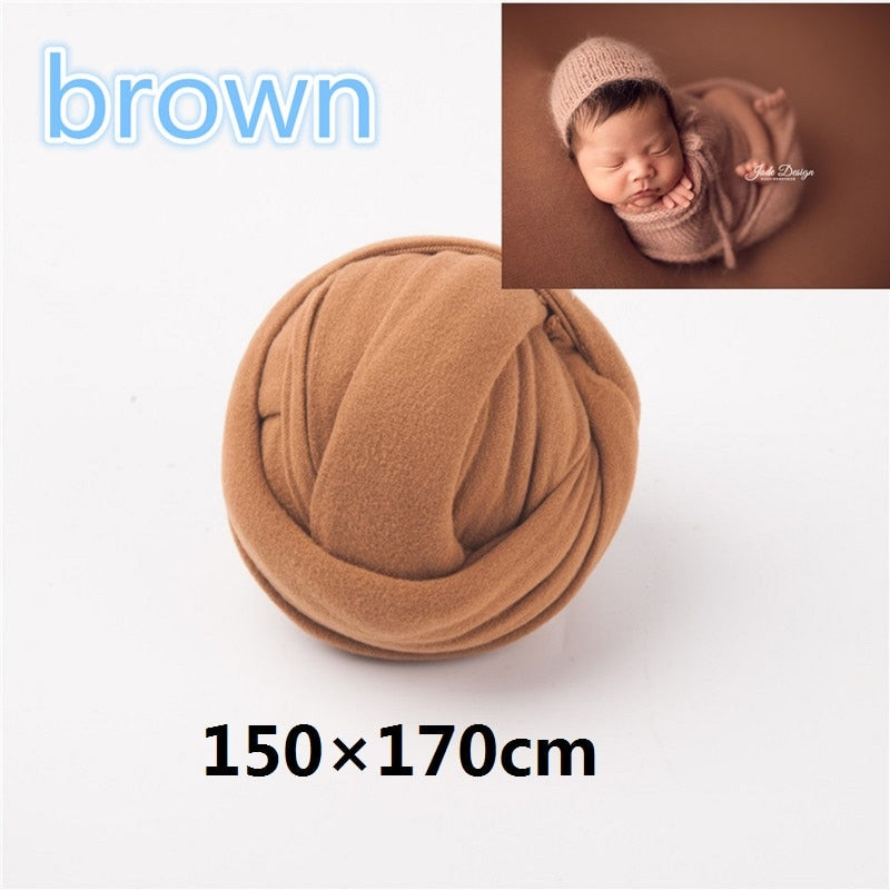 Newborn wrap and matching textured backdrop rolled up for easy storage
