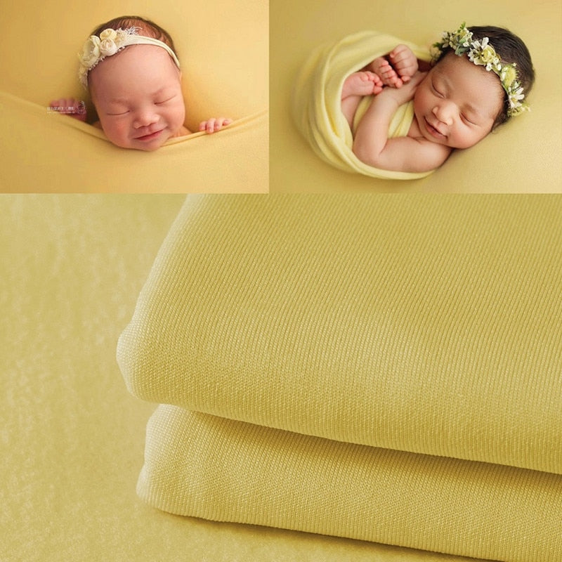 Neutral newborn photography wrap and simple backdrop, perfect for baby essentials