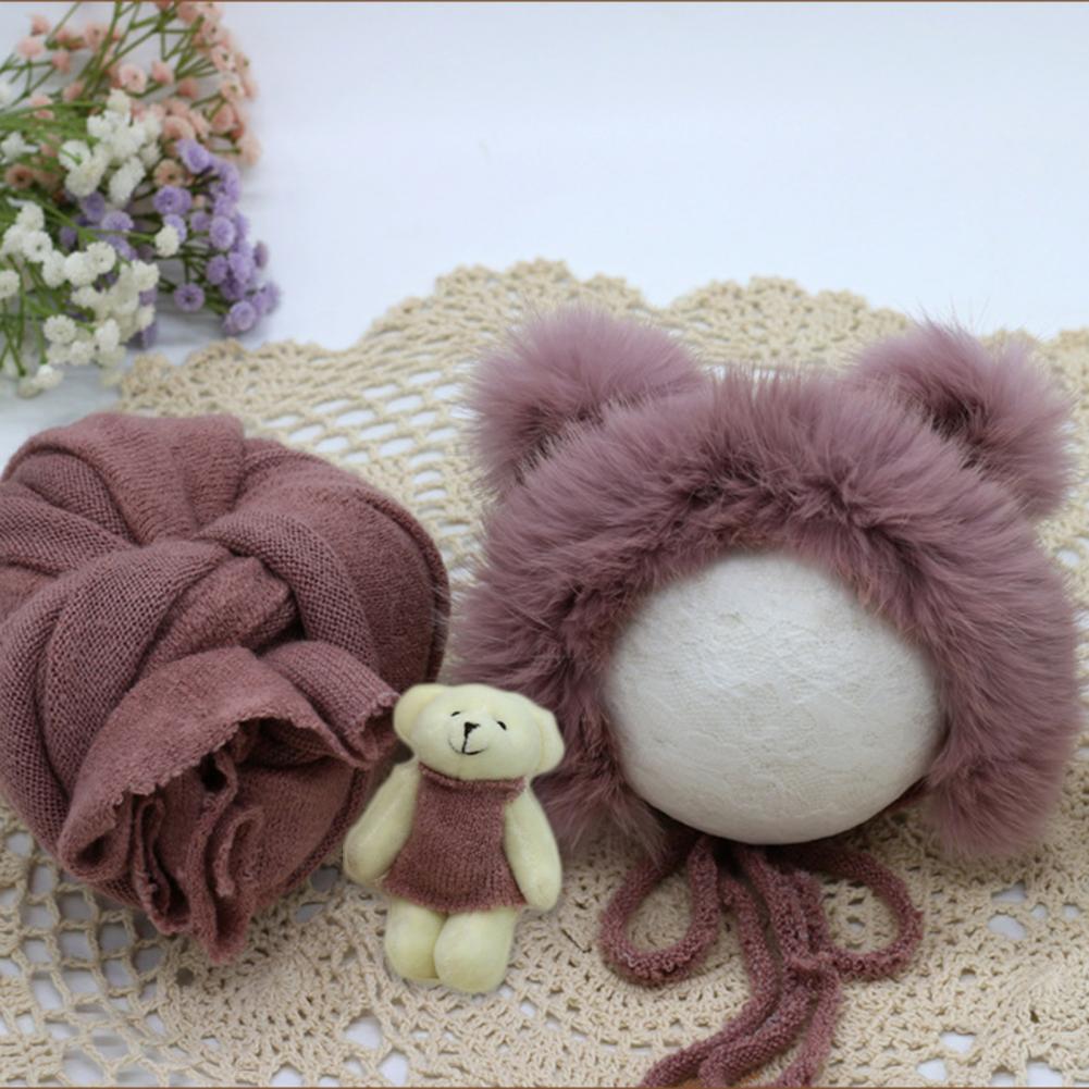 Soft fabric newborn swaddle blanket, hat, and doll for professional or home baby photo shoots.