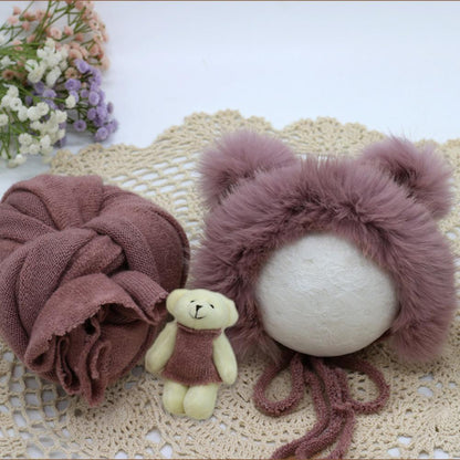 Soft fabric newborn swaddle blanket, hat, and doll for professional or home baby photo shoots.