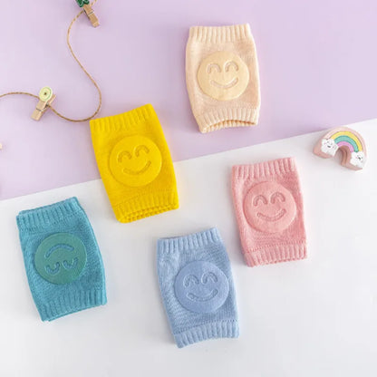 Soft pink baby crawling knee pads, perfect for infant leg warmth and protection on hard floors.
