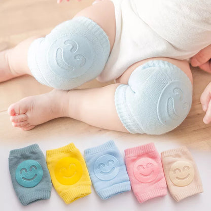 Pair of blue baby knee pads with anti-slip dots, ideal for toddlers learning to crawl safely.