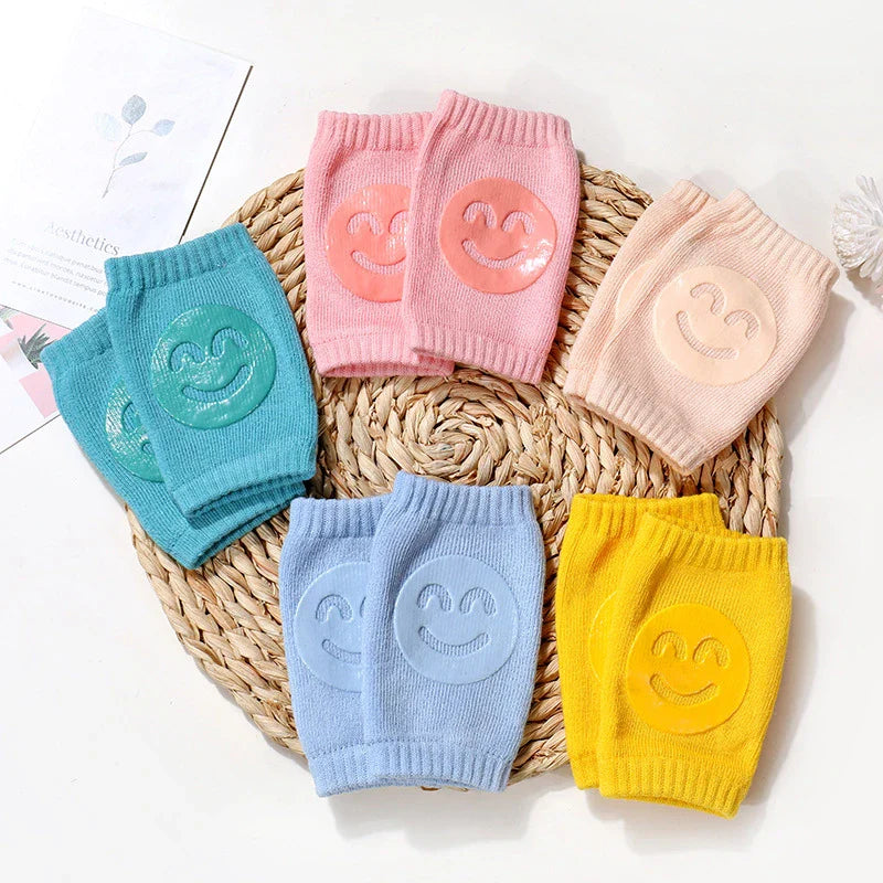 Close-up of yellow baby leg warmers with thick cushioning, providing protection for newborn crawling.