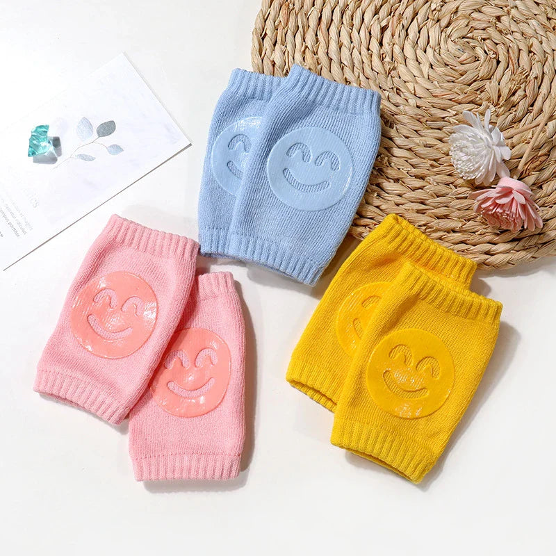Green baby crawling knee pads, featuring breathable cotton for comfort during active play.
