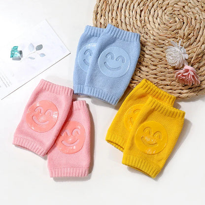 Green baby crawling knee pads, featuring breathable cotton for comfort during active play.
