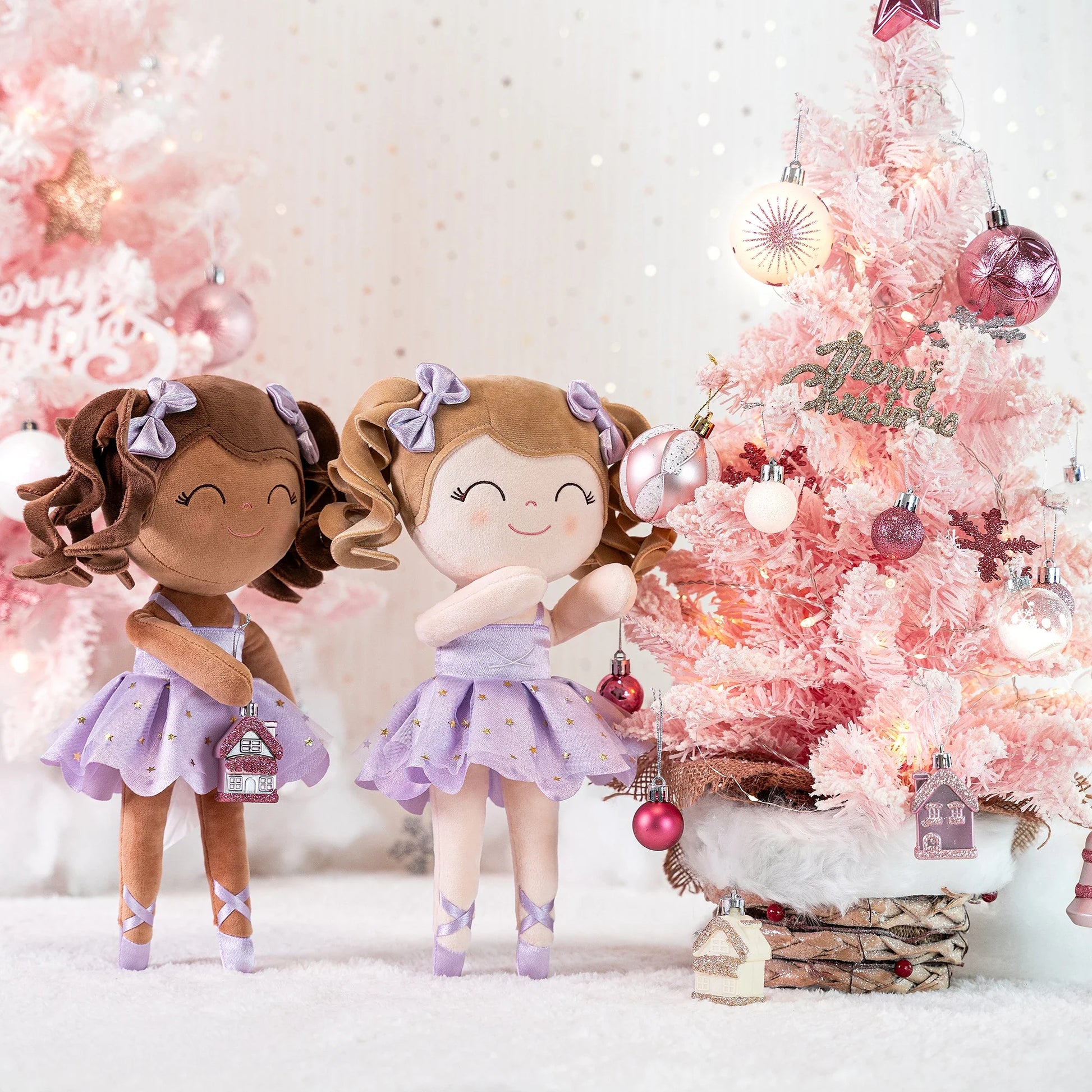 Charming ballerina stuffed animal in pink with a delicate crown and pleated tutu, a lovely cuddle toy.