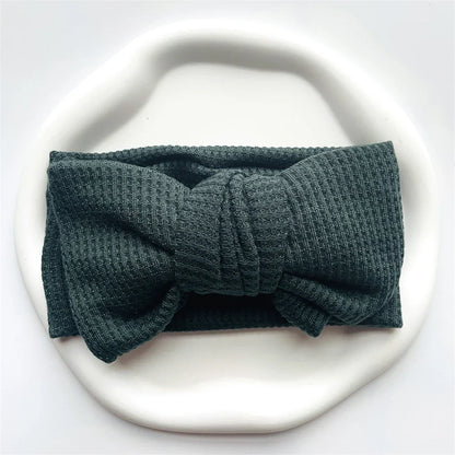 Navy blue soft cotton baby headband with bow, suitable for infants