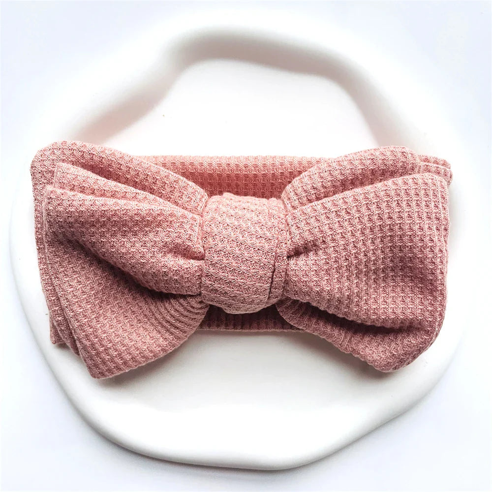 Black cotton baby girl bow headband, a chic and soft headwear option