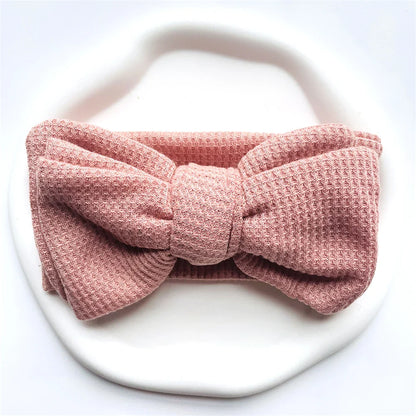 Black cotton baby girl bow headband, a chic and soft headwear option