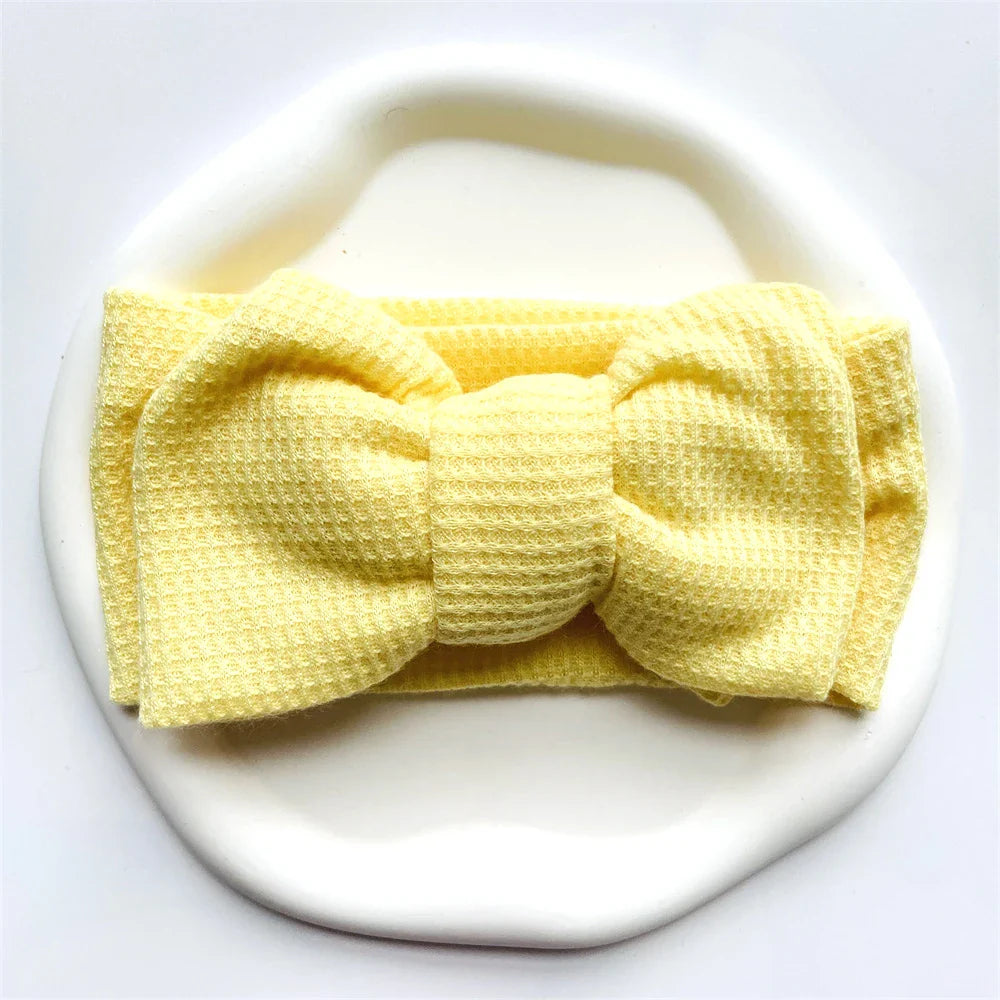 Collection of colorful soft cotton baby headbands with bows for infant girls