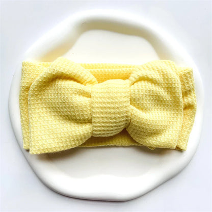 Collection of colorful soft cotton baby headbands with bows for infant girls