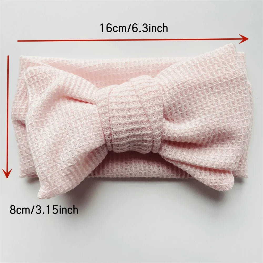 Display of various soft cotton bow headbands for baby and toddler girls