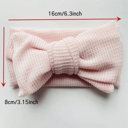Display of various soft cotton bow headbands for baby and toddler girls