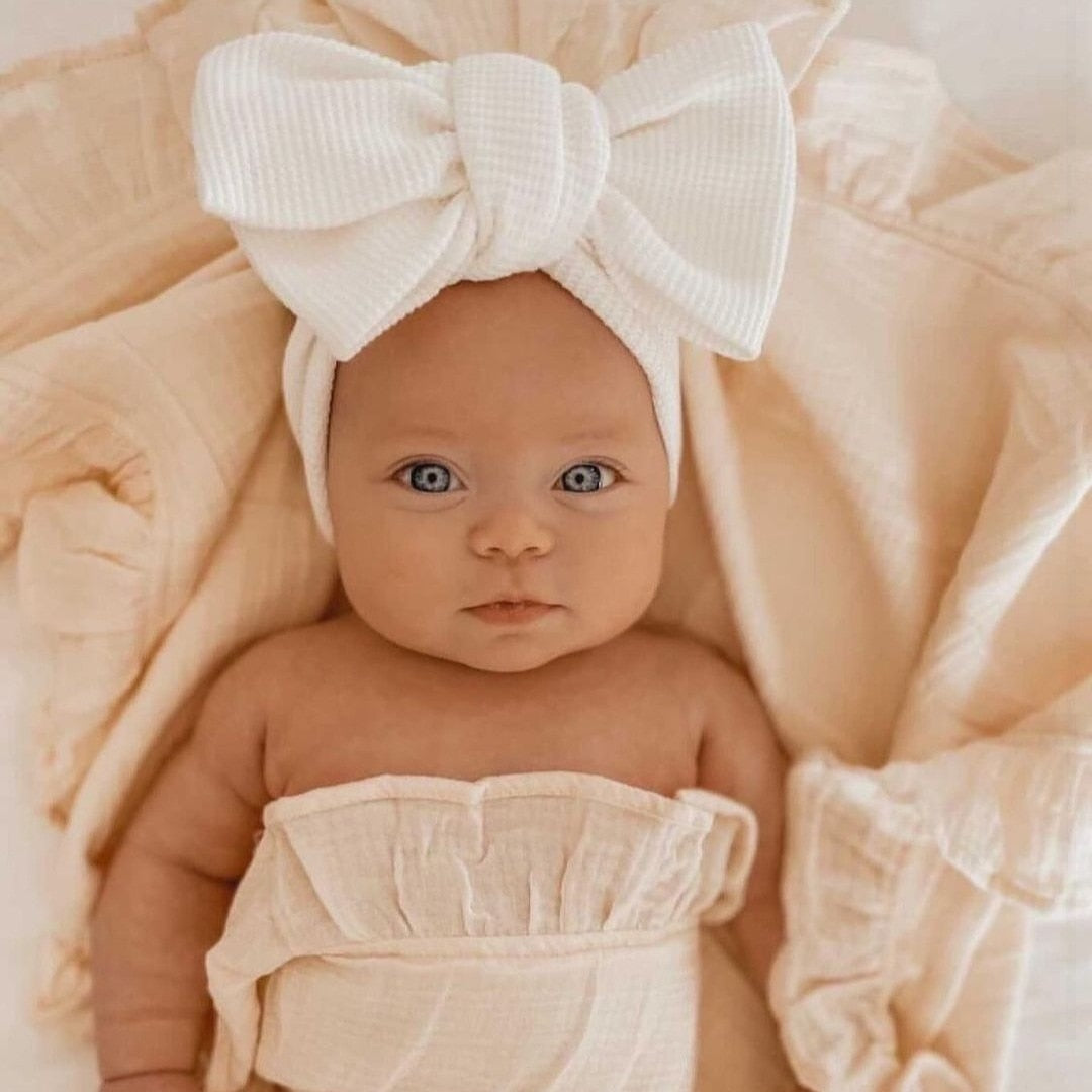 Soft pink elastic bow headband for baby girls, perfect infant hair accessory