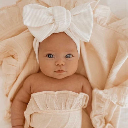 Soft pink elastic bow headband for baby girls, perfect infant hair accessory