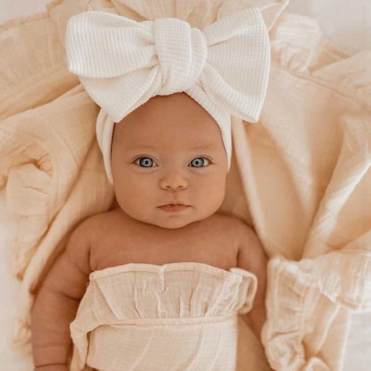Soft pink elastic bow headband for baby girls, perfect infant hair accessory