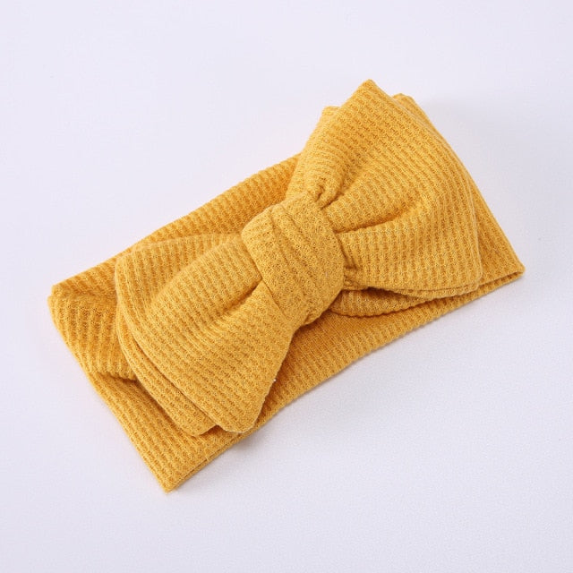 Baby girl's purple elastic bow headband, a delightful infant hair accessory