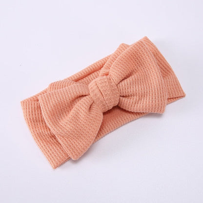 White elastic bow headband for baby girls, ideal for newborn baby fashion