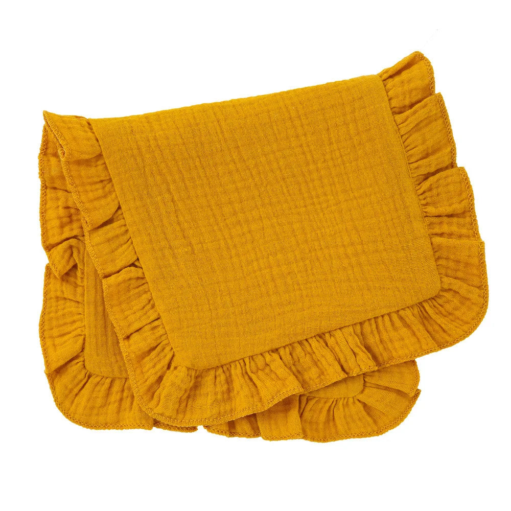 Unfolded mint green muslin cotton burp cloth with a dainty ruffle edge, provides full coverage for burping.
