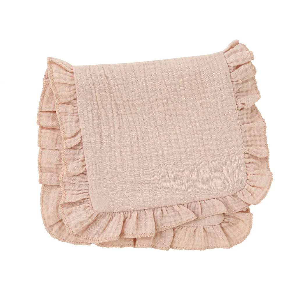 Baby burp cloth in light blue muslin with ruffle edge, practical and stylish for newborn accessory.