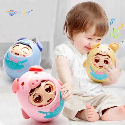 Soft pink pig musical tumbler toy for baby, sensory educational play with teether