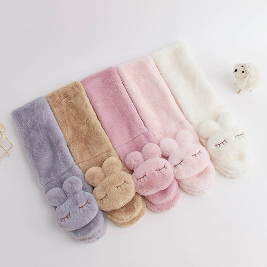 Soft pink plush bunny scarf for children, perfect for warm winter wear and baby clothing.